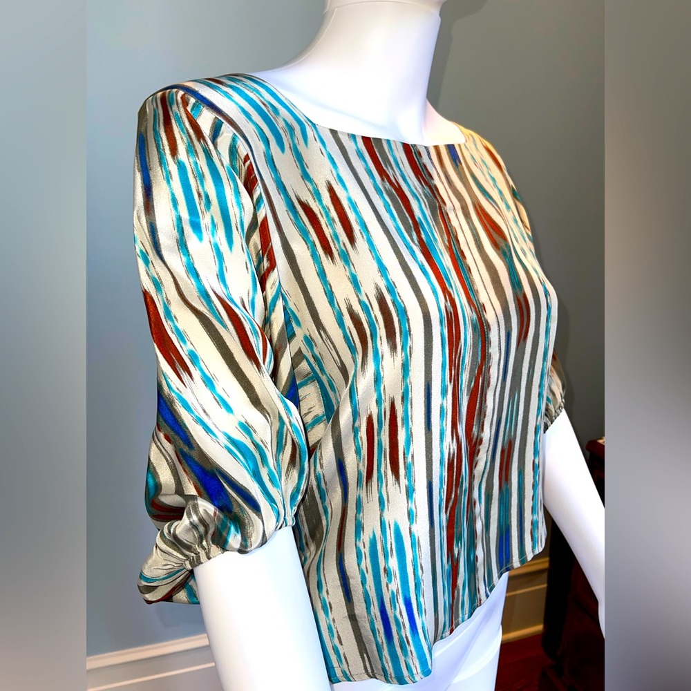 Tucker silk blouse. Fun colors of blue, rust cream silver. Size small
